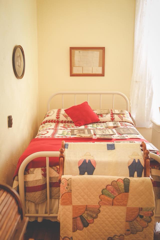 Our Memories Room is a walk back in time.  It has a Double Bed with a handpieced quilt.  The bed is one of the original iron beds.  The room does not have a bathroom, but one is available down the hall.